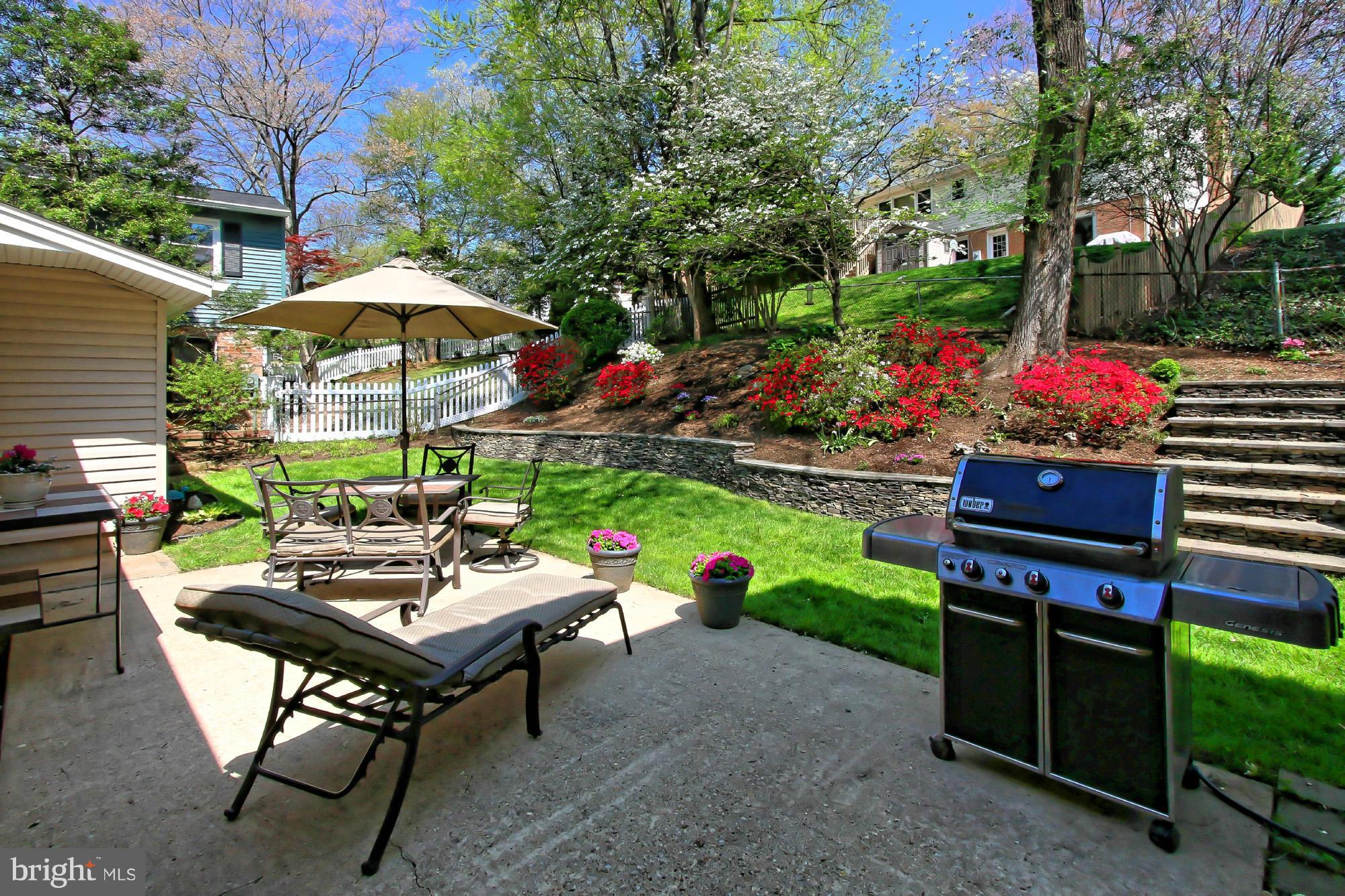 7012 Hadlow Drive Springfield, VA 22152 - Photo 28 of 30 a view of a patio with a table and chairs