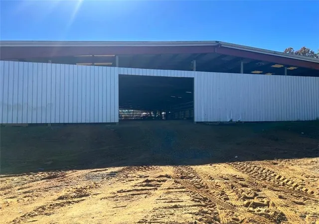 a view of a house with backyard and porch