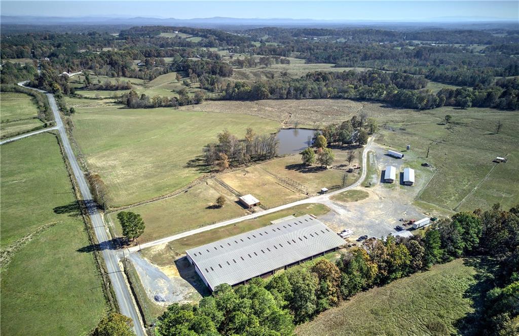 486 County Line Road Resaca, GA 30735 - Photo 2 of 66 an aerial view of a house with outdoor space