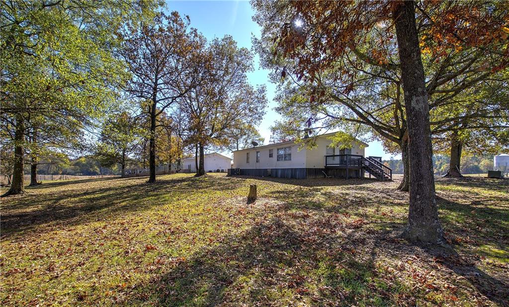 486 County Line Road Resaca, GA 30735 - Photo 36 of 66 a house with trees in front of it