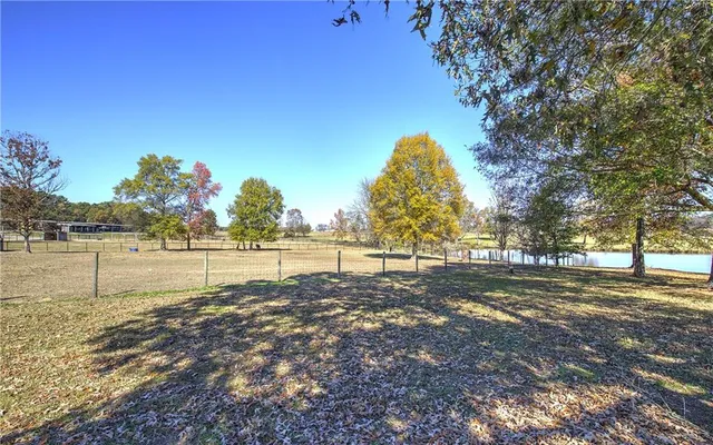 a view of a swimming pool with an outdoor space and seating area