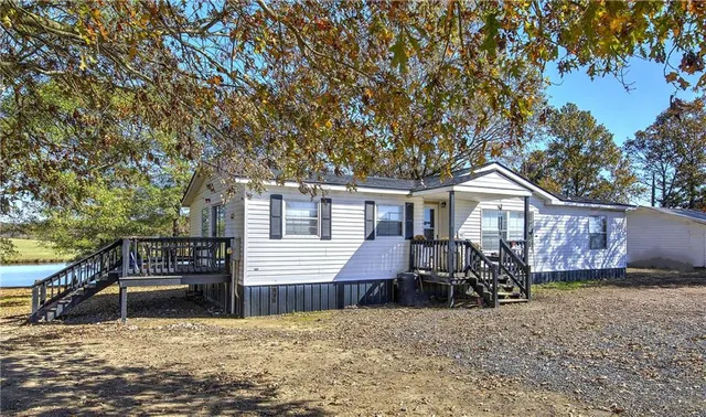a view of a swimming pool with a lake view