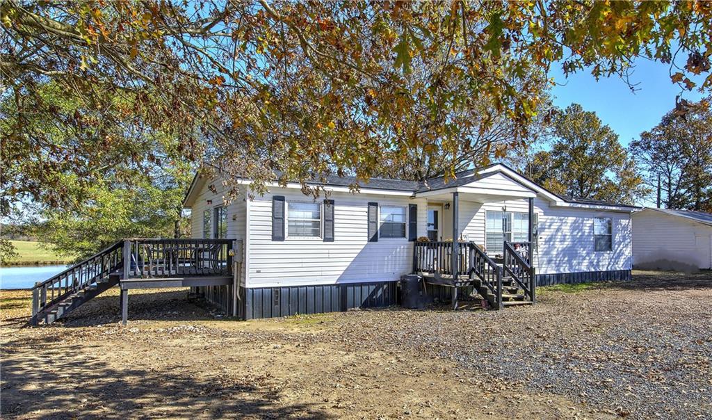 486 County Line Road Resaca, GA 30735 - Photo 43 of 66 a view of a house with a yard