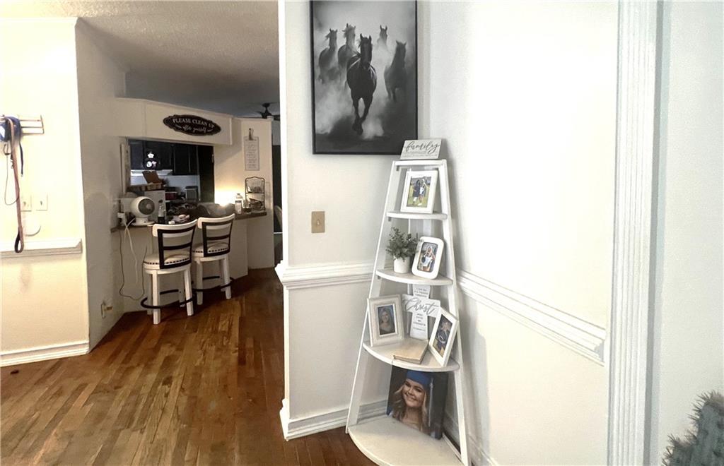 486 County Line Road Resaca, GA 30735 - Photo 46 of 66 a view of a hallway with furniture and wooden floor