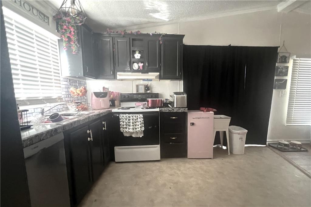 486 County Line Road Resaca, GA 30735 - Photo 48 of 66 a kitchen with a sink a stove and refrigerator
