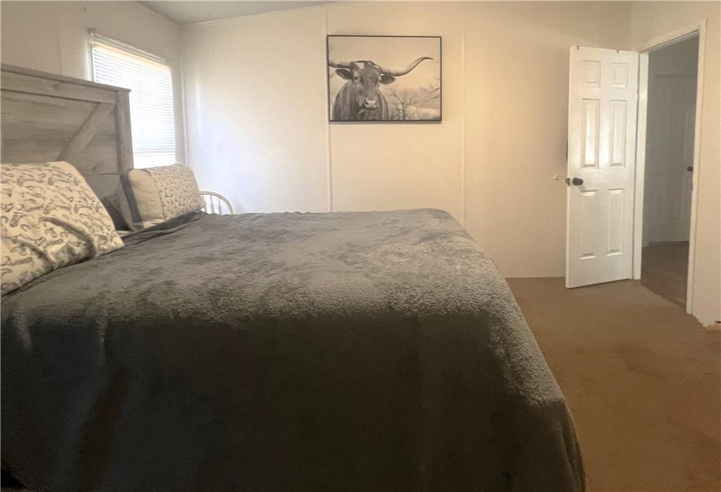 486 County Line Road Resaca, GA 30735 - Photo 49 of 66 a bedroom with a bed and wall painting