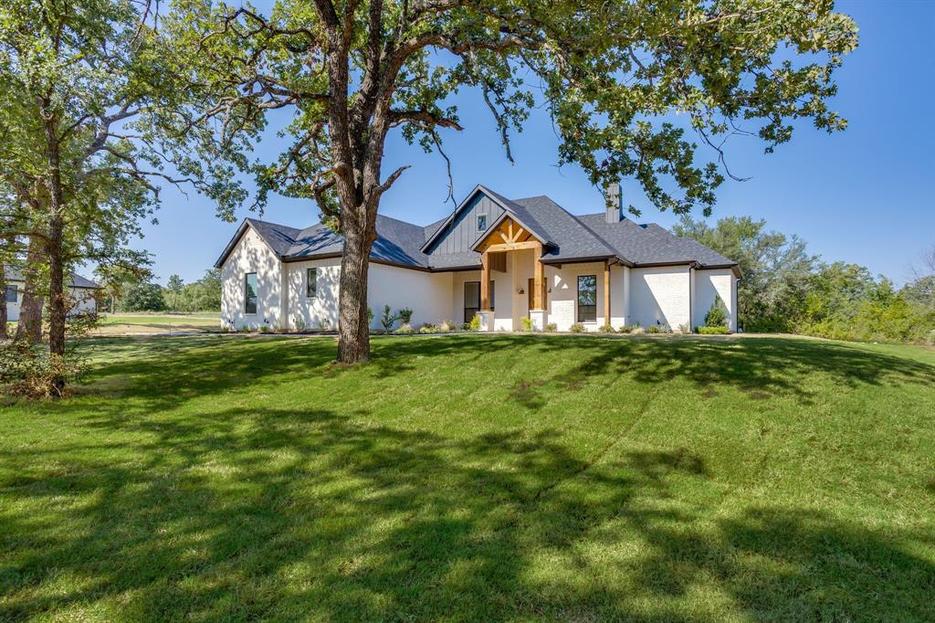173 Oak Grv Way Springtown, TX 76082 - Photo 1 of 39 Gorgeous new build on 1 acre with trees and many upgrades1