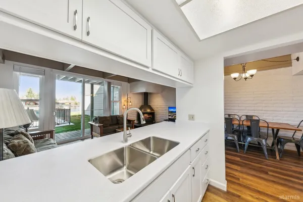 a kitchen with a sink and cabinets