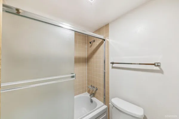 a bedroom with a bed and a walk in closet