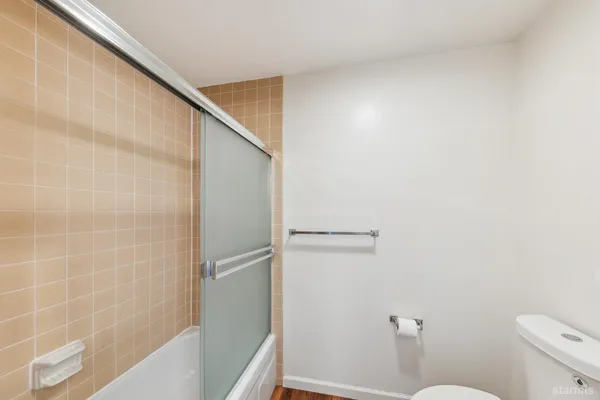 a view of a hallway with washer and dryer