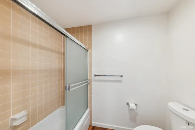 a view of a hallway with washer and dryer