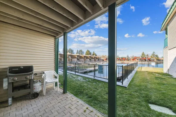 a view of a swimming pool with outdoor seating