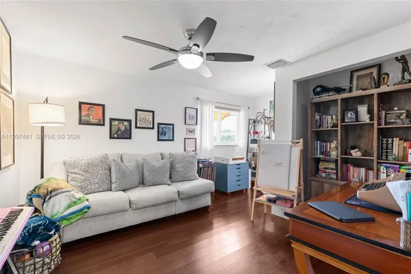 a view of a dining room with furniture and wooden floor