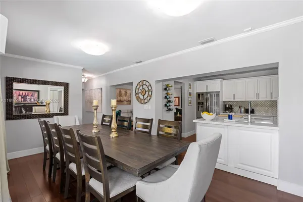 a kitchen with cabinets stainless steel appliances and a counter space