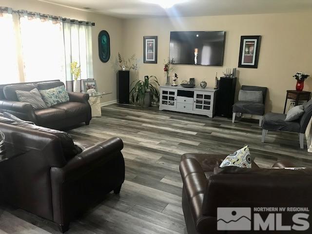 8950 Convair Way Reno, NV 89506 - Photo 2 of 26 a living room with furniture and wooden floor