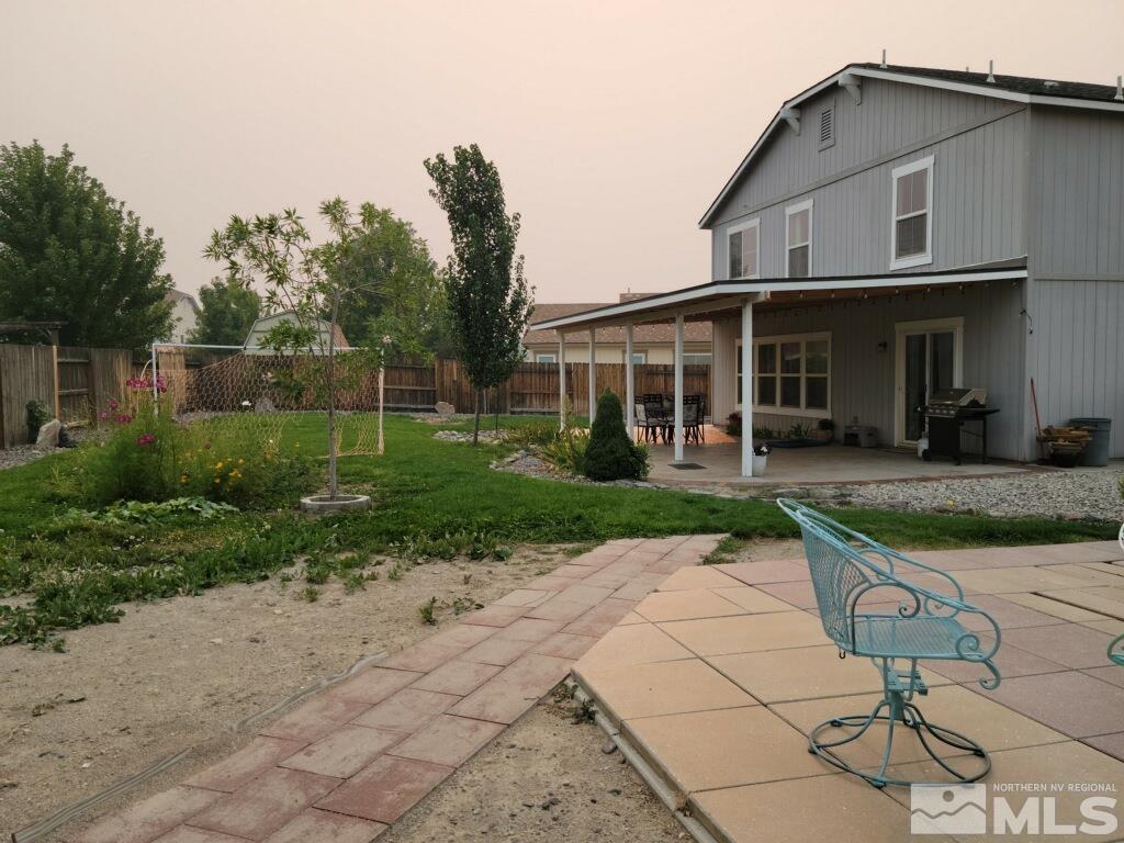 8950 Convair Way Reno, NV 89506 - Photo 25 of 26 a front view of a house with garden