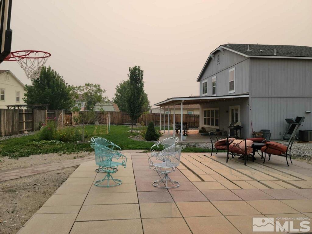 8950 Convair Way Reno, NV 89506 - Photo 26 of 26 a view of a house with backyard sitting area and garden