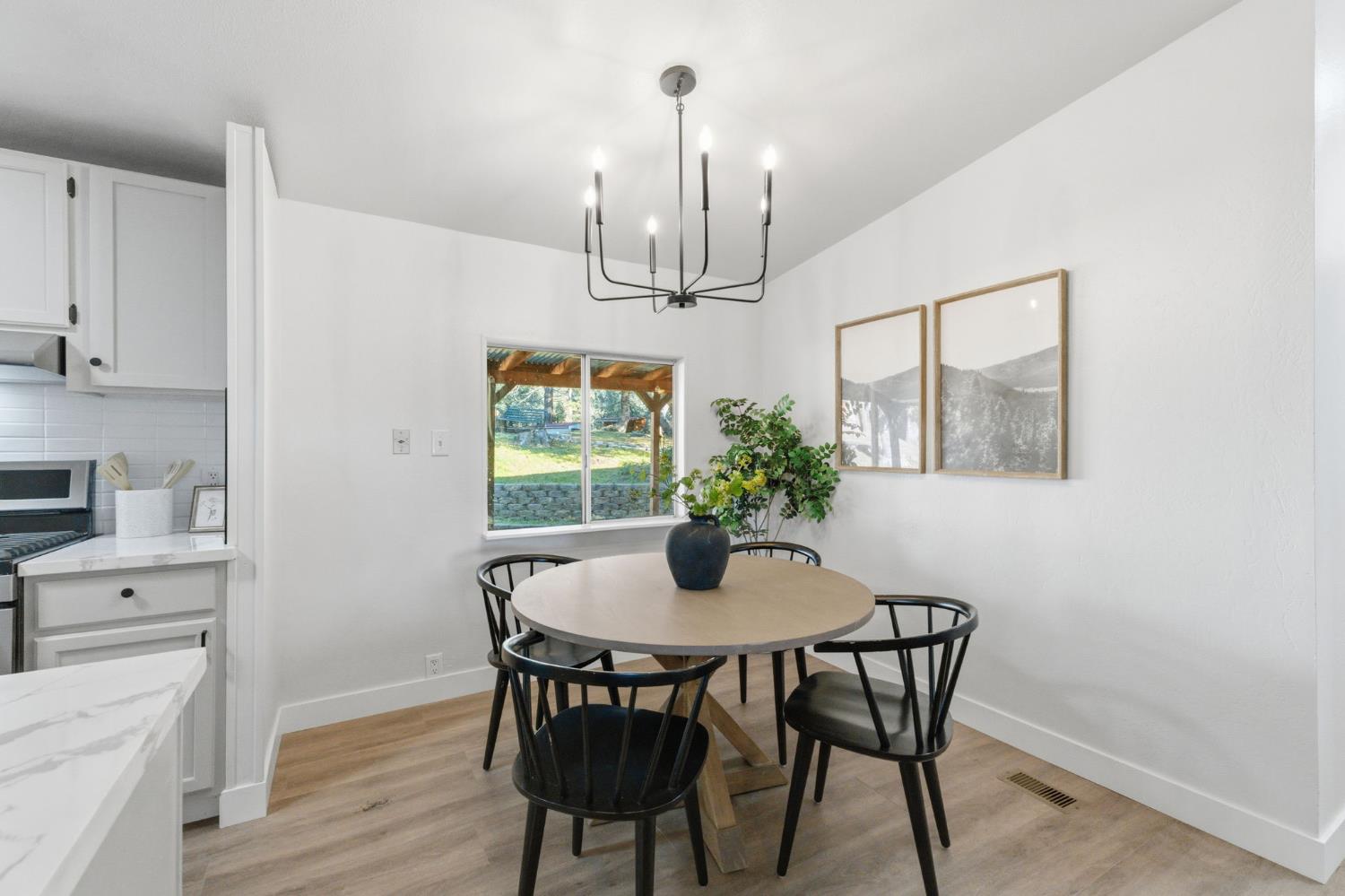 40089 John West Road Oakhurst, CA 93644 - Photo 13 of 59 a view of a dining room with furniture window and wooden floor