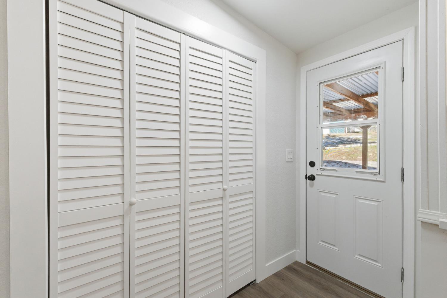 40089 John West Road Oakhurst, CA 93644 - Photo 21 of 59 a view of front door with wooden floor