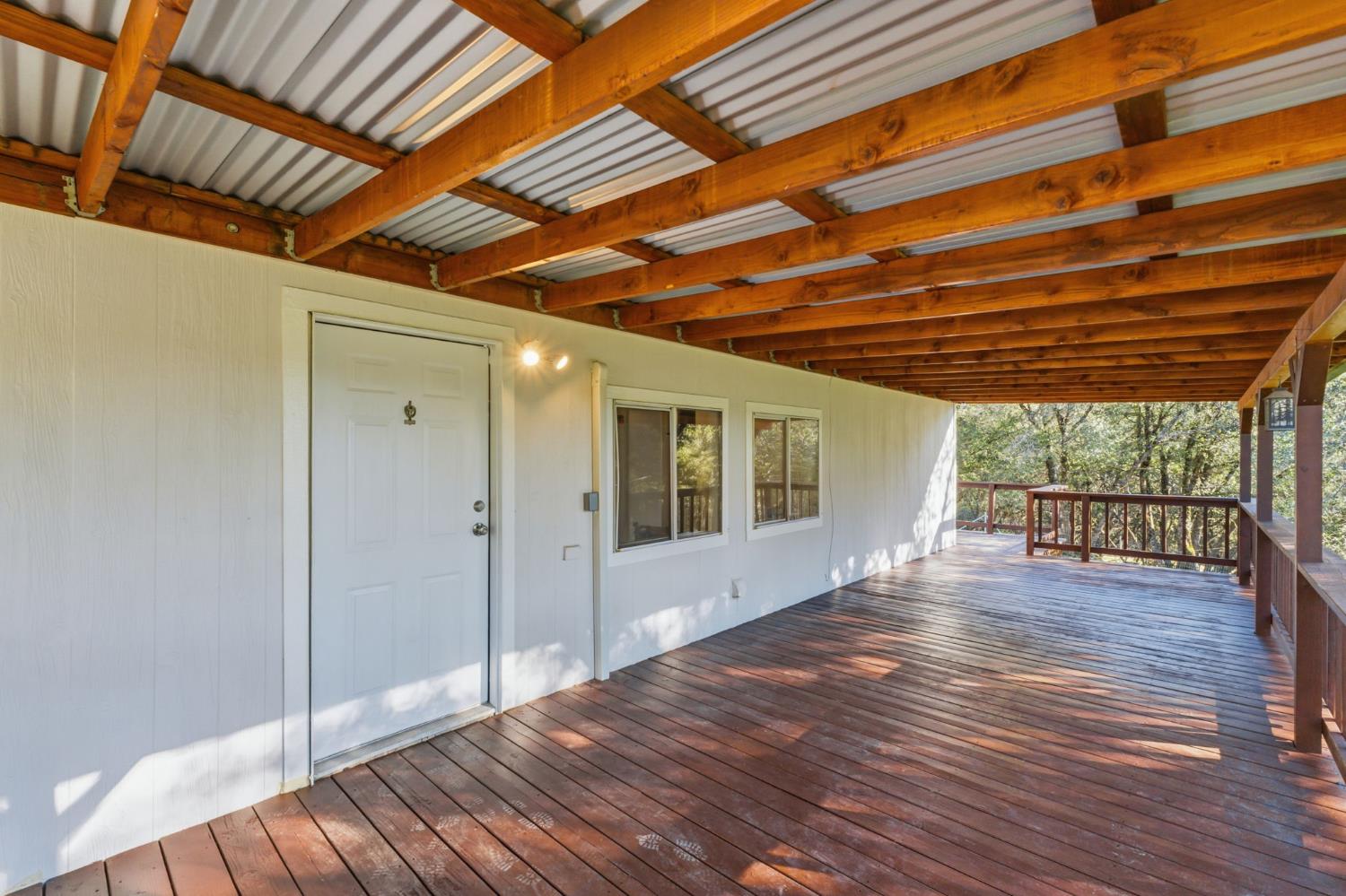 40089 John West Road Oakhurst, CA 93644 - Photo 32 of 59 a view of livingroom with wooden floor and door