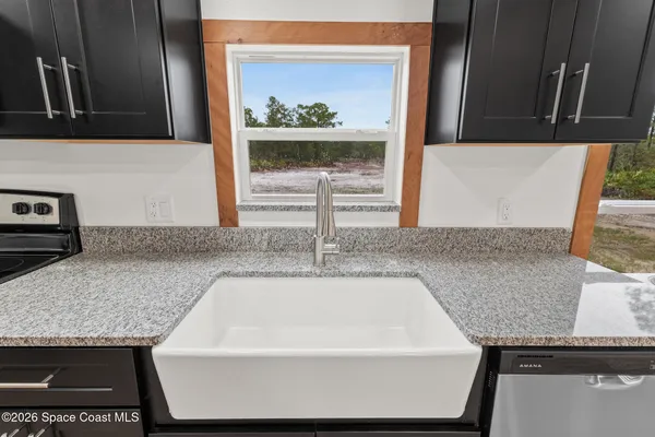 a kitchen with a stove and a microwave