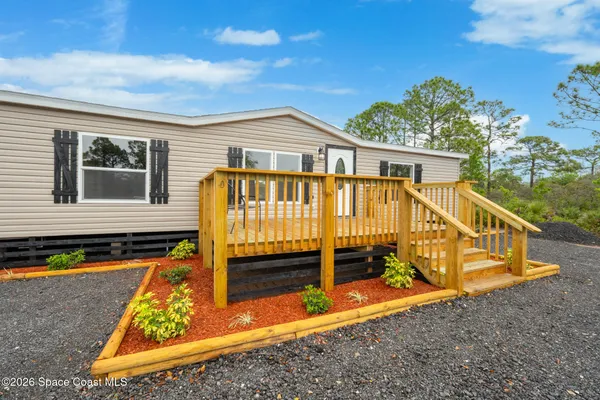 a view of swimming pool with a backyard
