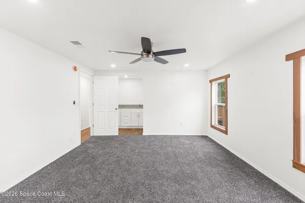 a bathroom with a granite countertop sink and vanity