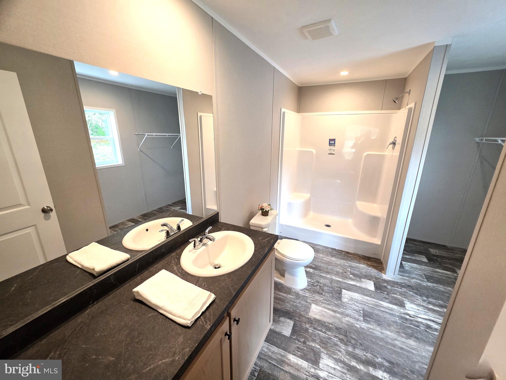 289 Grove Neck Road Earleville, MD 21919 - Photo 10 of 19 a bathroom with a sink a toilet a mirror and bathtub