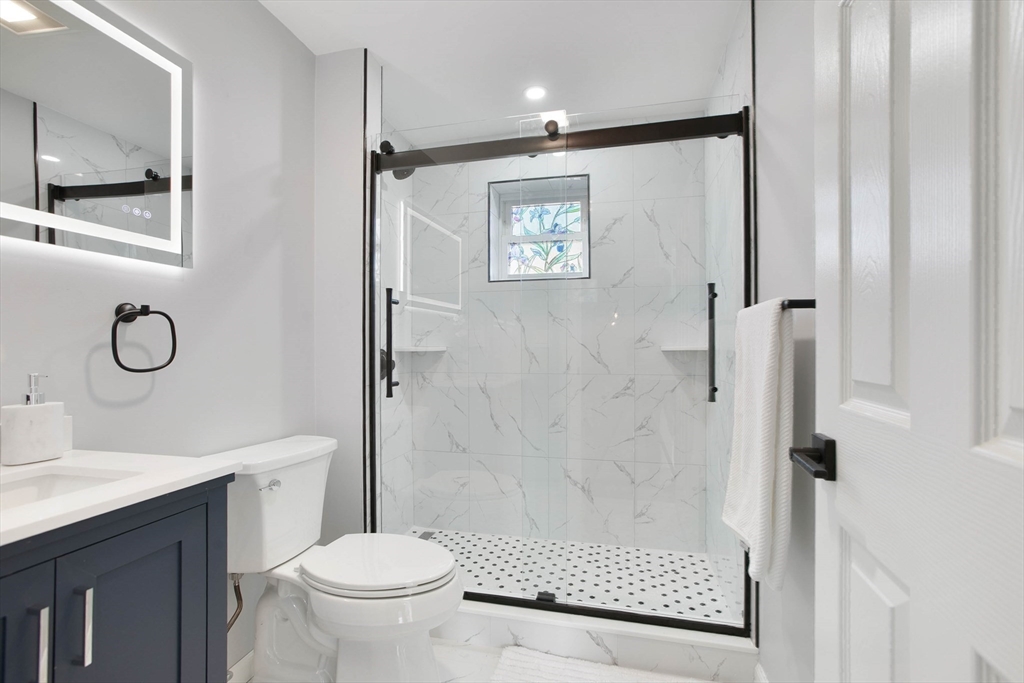 29 Lake View Place Lynn, MA 01904 - Photo 11 of 35 a bathroom with a shower a toilet and sink