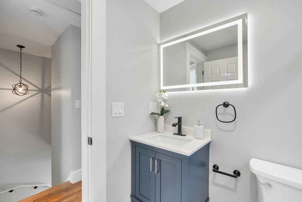 29 Lake View Place Lynn, MA 01904 - Photo 12 of 35 a bathroom with a sink vanity and a mirror
