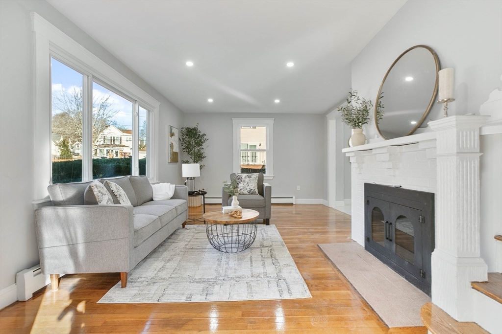 29 Lake View Place Lynn, MA 01904 - Photo 13 of 35 a living room with furniture a fireplace and a large window