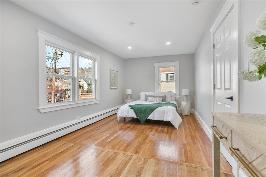 29 Lake View Place Lynn, MA 01904 - Photo 24 of 35 a spacious bedroom with a bed and wooden floor