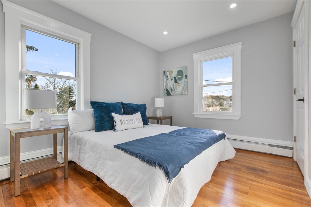 29 Lake View Place Lynn, MA 01904 - Photo 28 of 35 a spacious bedroom with a large bed and a table