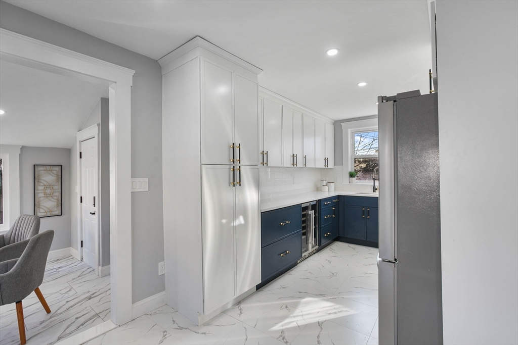 29 Lake View Place Lynn, MA 01904 - Photo 3 of 35 a kitchen with stainless steel appliances a refrigerator sink and cabinets