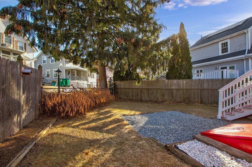 29 Lake View Place Lynn, MA 01904 - Photo 32 of 35 a view of a yard with wooden fence