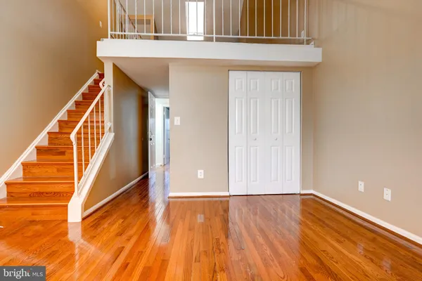a view of an entryway with wooden floor