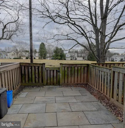 a view of a house with wooden fence