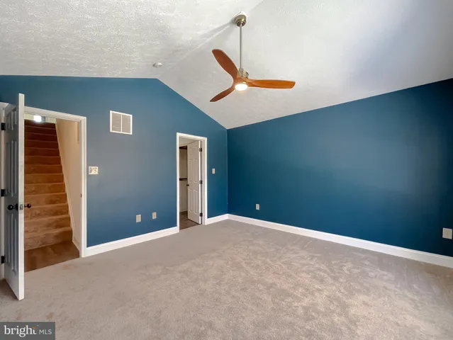 a view of a livingroom with a staircase