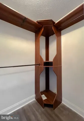 a view of a livingroom with a ceiling fan and window