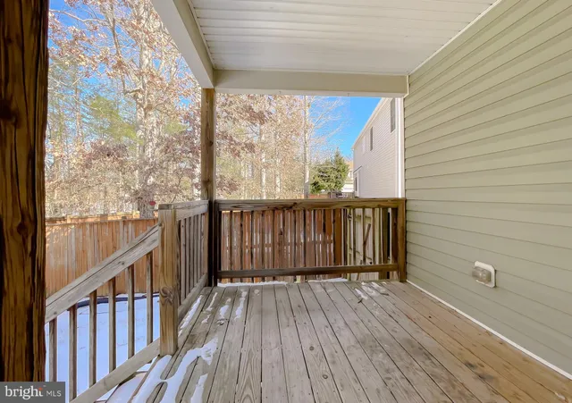 a view of a balcony with wooden floor