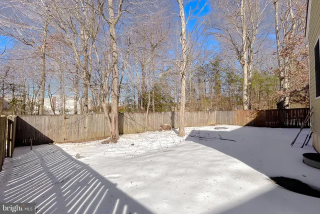 a view of roof deck with a barbeque and wooden stairs
