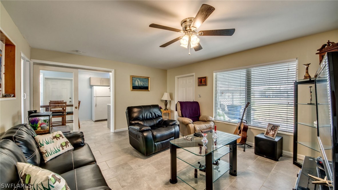 101 Oregon Road West Lehigh Acres, FL 33936 - Photo 6 of 24 a living room with furniture and a large window
