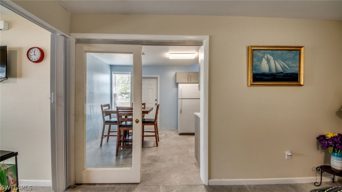 101 Oregon Road West Lehigh Acres, FL 33936 - Photo 9 of 24 a dining room with furniture and a mirror