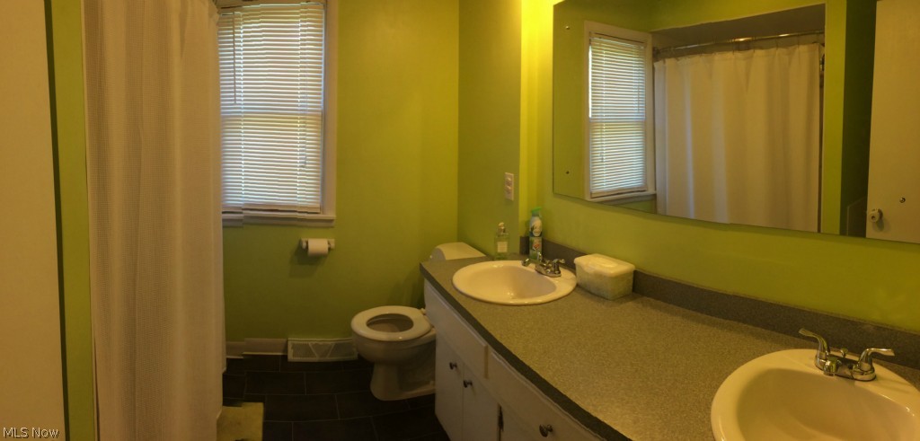255-259 Swartz Road Akron, OH 44319 - Photo 8 of 21 Full bath, his & her sinks, shower/bath combo, stacker washer and dryer- 2nd floor laundry.-255