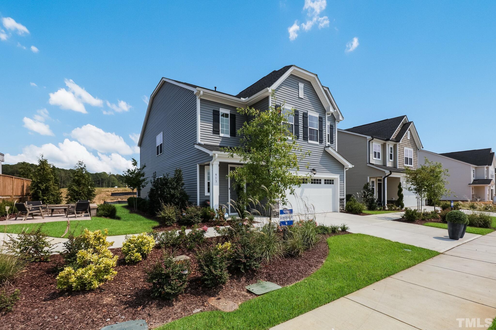 155 Kettleton Circle, Unit 371 Raleigh, NC 27610 - Photo 5 of 38 a front view of a house with a yard