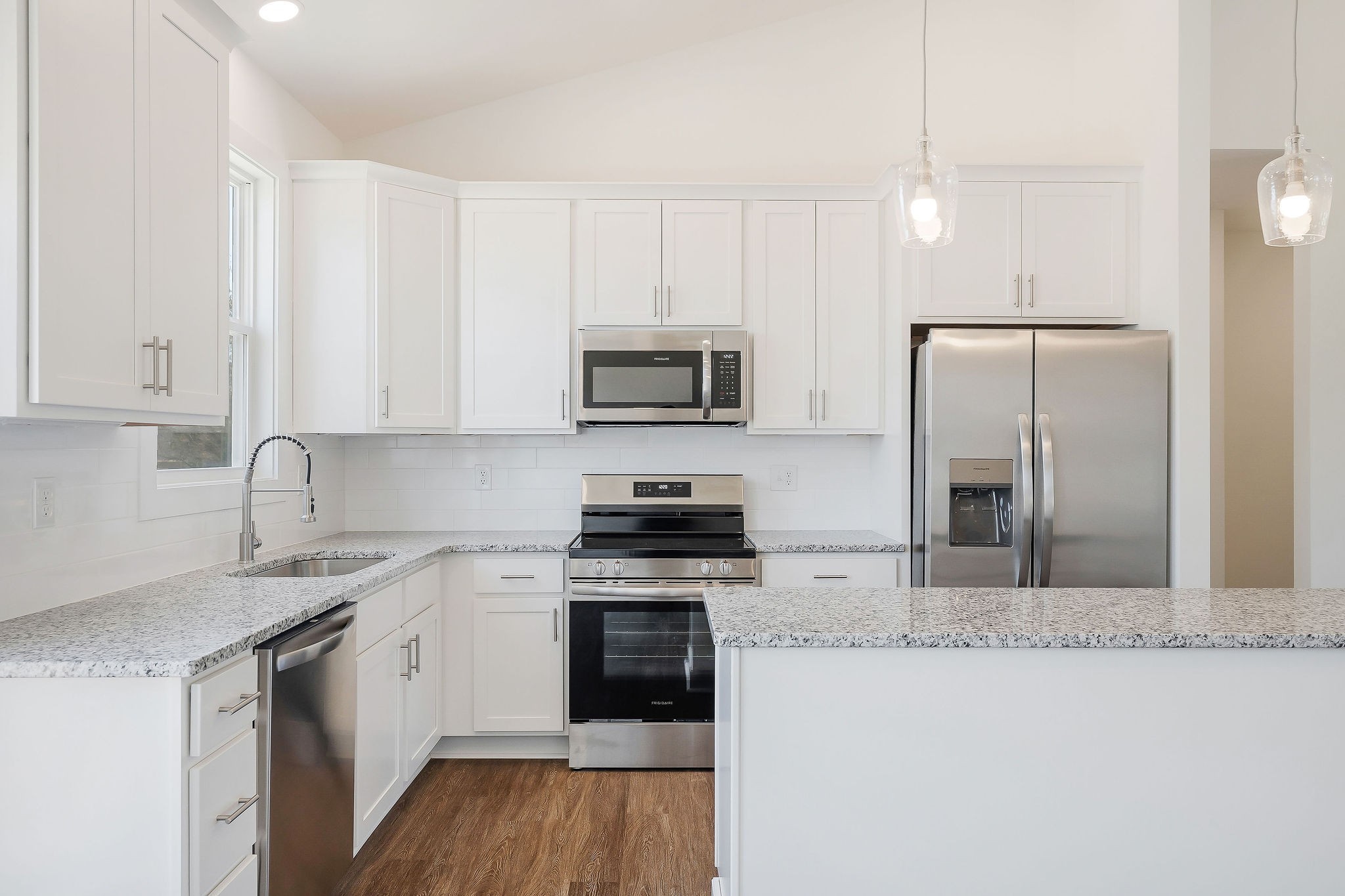 194 Johnson Chapel Road Sparta, TN 38583 - Photo 13 of 35 a kitchen with stainless steel appliances granite countertop a stove a sink and a refrigerator