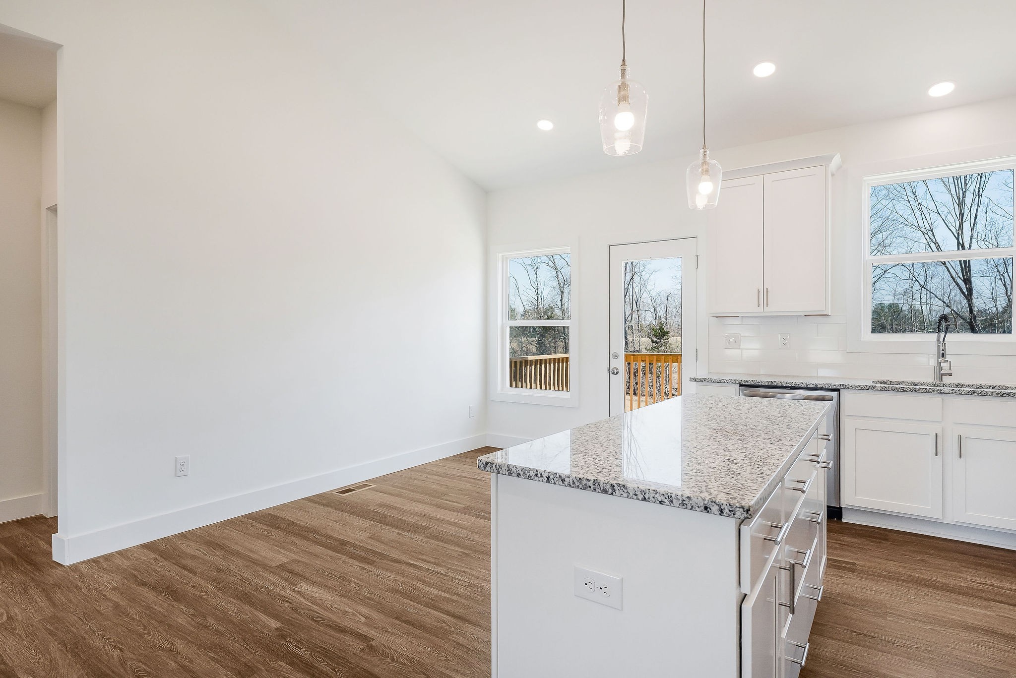 194 Johnson Chapel Road Sparta, TN 38583 - Photo 15 of 35 a kitchen with granite countertop a sink and a stove top oven