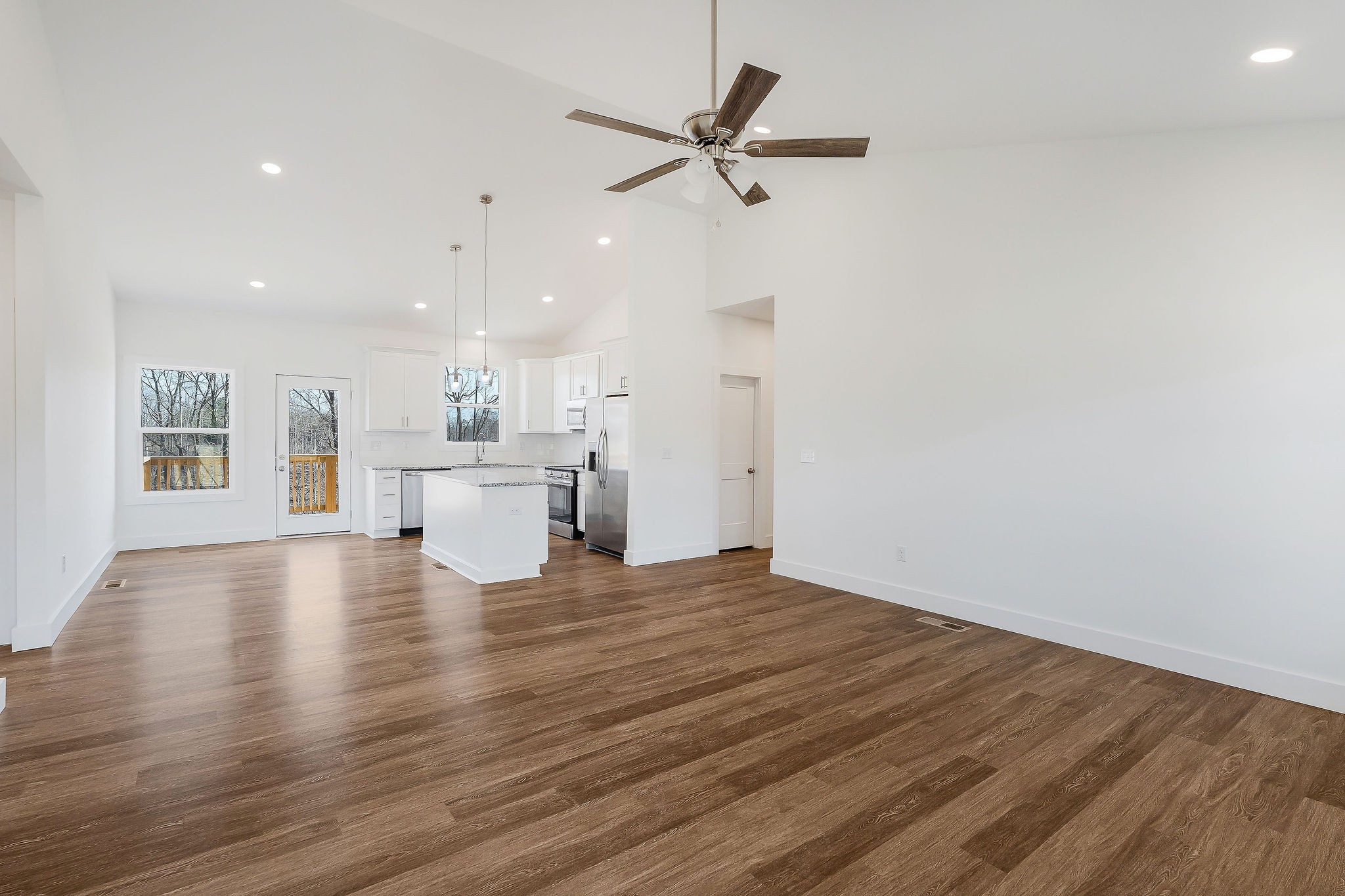 194 Johnson Chapel Road Sparta, TN 38583 - Photo 8 of 35 a view of an empty room with a window and wooden floor