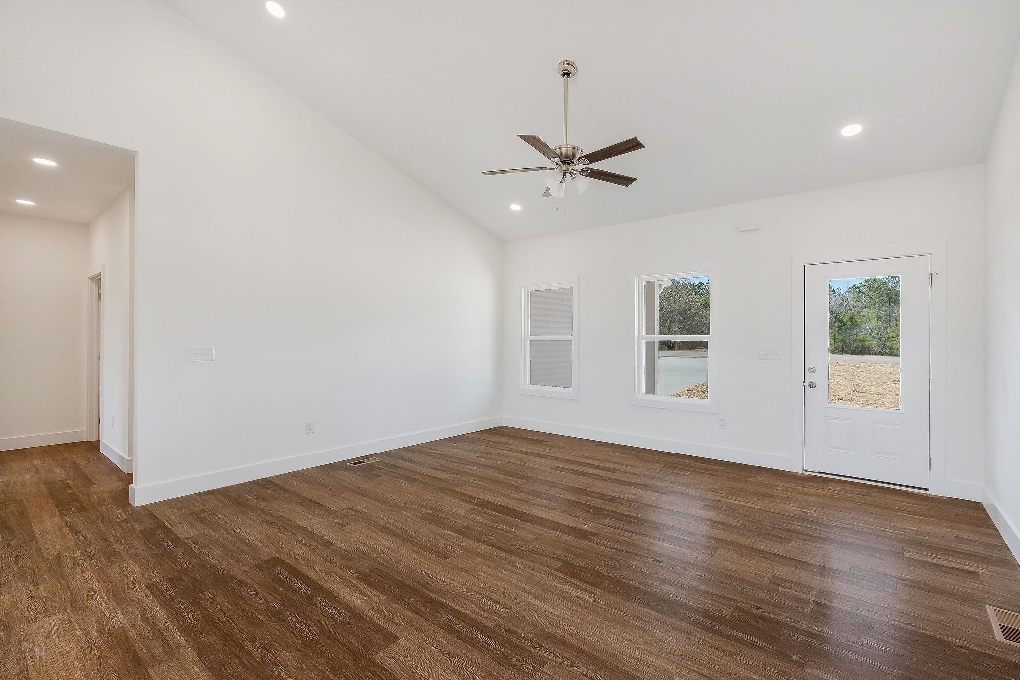 194 Johnson Chapel Road Sparta, TN 38583 - Photo 9 of 35 a view of empty room with wooden floor and fan