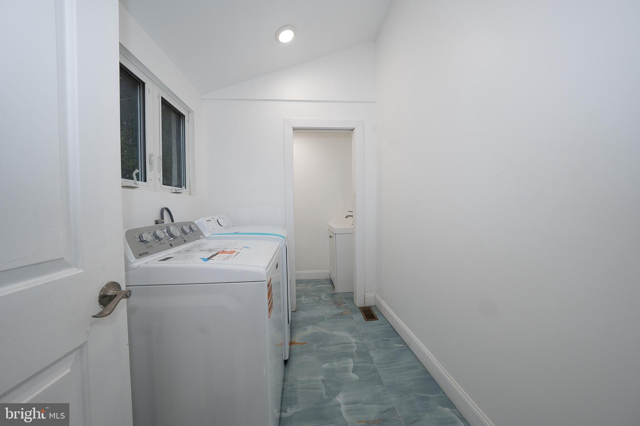 622 Spring Avenue Elkins Park, PA 19027 - Photo 15 of 65 a utility room with dryer and washer